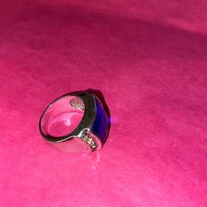 Fashion- chunky blue stone ring. Missing one of the tiny stones